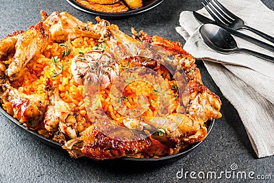 Jollof rice with chicken and plantains Stock Photo