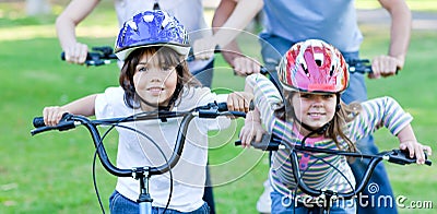 Jolly children riding a bike Stock Photo