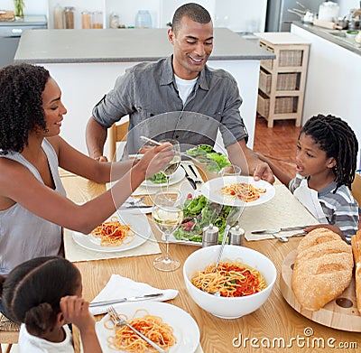 Jolly family dining together Stock Photo