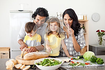 Jolly family preparing lunch together in the kitch Stock Photo