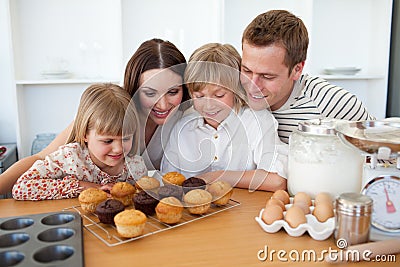 Jolly family presenting their muffins Stock Photo