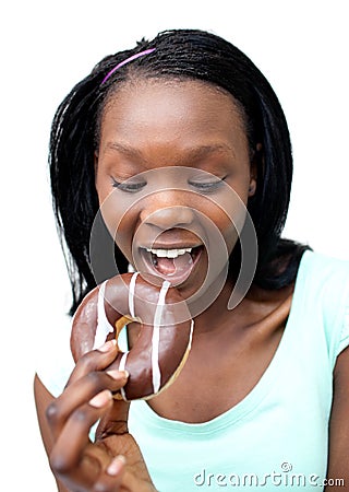 Jolly young woman eating a chocolate donut Stock Photo