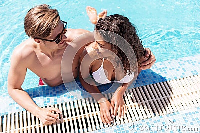 Jolly youthful man and woman enjoying their rest in water Stock Photo