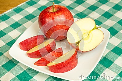 Jonagold apple slices on a white plate Stock Photo