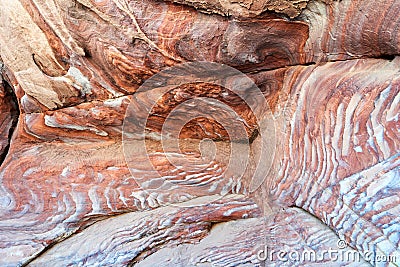 Jordan. Petra archaeological site. Colorful red rocks into cave Stock Photo