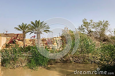 Jordan River divides the borders between Israel and Jordan Stock Photo