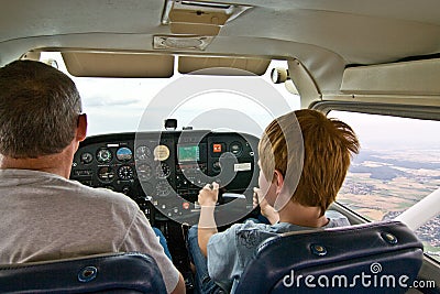 Joung boy is flying aircraft Stock Photo