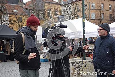 Journalist and cameraman at work Editorial Stock Photo