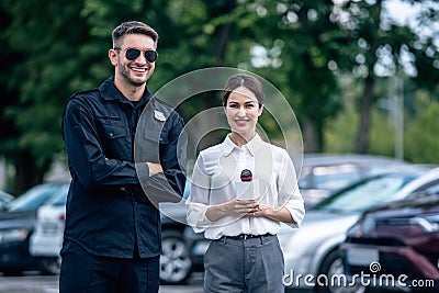 Journalist holding microphone and handsome policeman in uniform Stock Photo