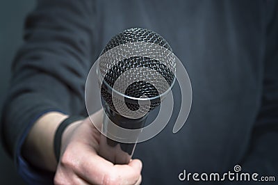 Journalist making speech with microphone and hand gesturing concept for interview. Stock Photo