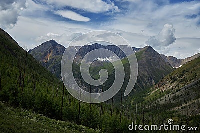 Journey through Altai Mountains, amazing nature of mountain peaks, rivers and streams flow down from slope of mountains. Altai Stock Photo