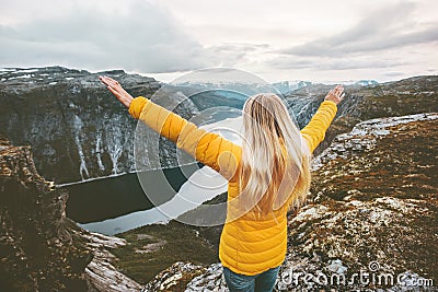 Journey in mountains Woman traveling happy raised hands Stock Photo