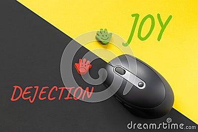 Joy as an alternative to dejection, a way out of depression concept. PC mouse and cheerful and sad emoticons on yellow Stock Photo