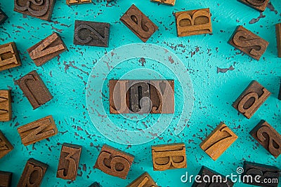 Joy Spelled in Wooden Type Set Block Letters Stock Photo