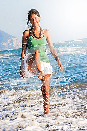 Joy summer. Girl playing on the seashore. Sea and holidays. Stock Photo