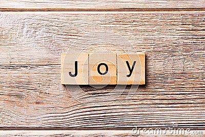 Joy word written on wood block. Joy text on wooden table for your desing, concept Stock Photo