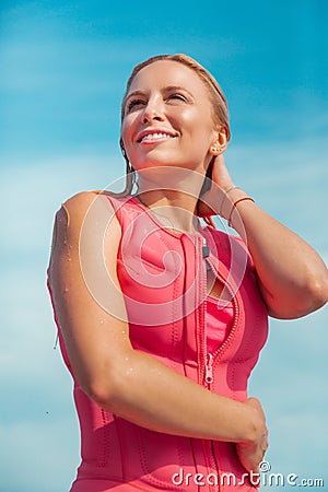 Joyful Caucasian blonde woman with wet blonde hair Stock Photo