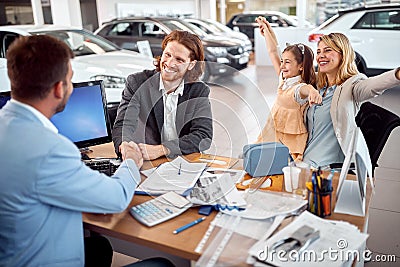 Joyful caucasian family buying a car together Stock Photo