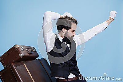 Joyful doorkeeper being funny in studio Stock Photo