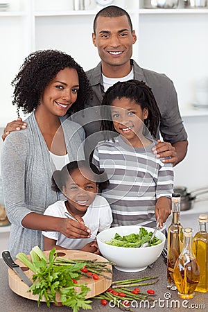 Joyful family preparing dinner Stock Photo