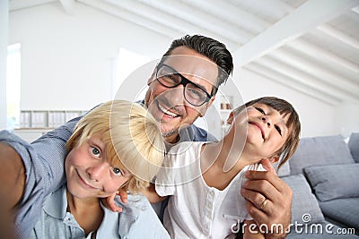 Joyful father and children having fun Stock Photo