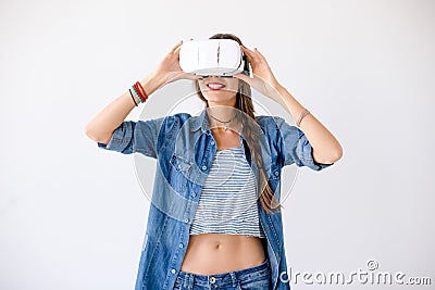 Joyful girl using VR device Stock Photo