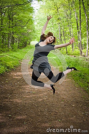 Joyful Jumping Woman Stock Photo