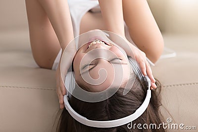 Joyful lady enjoying popular music in headphones Stock Photo