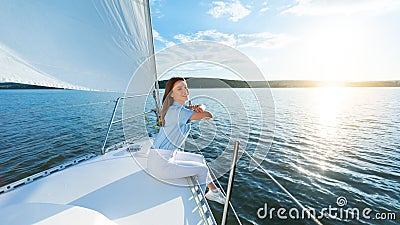 Joyful Lady Sitting On Yacht Deck Enjoying Sea Sailing Tour Stock Photo