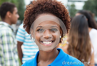 Joyful laughing african american woman with group of friends Stock Photo