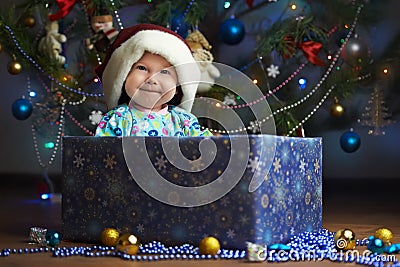Joyful little baby in the present box Stock Photo