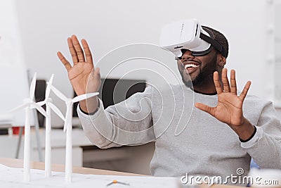 Joyful male environmentalist being in virtual reality Stock Photo