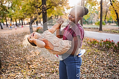 Joyful Playtime in Autumn Park Stock Photo