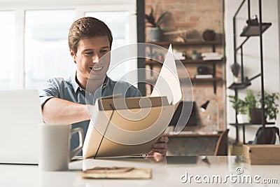 Joyful skillful employee is holding document case Stock Photo