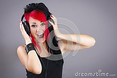 Joyful teenage girl listening to the music Stock Photo