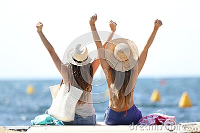 Joyful tourists on summer vacations on the beach Stock Photo