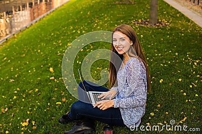Joyful woman skilled freelance social media content writer with beautiful smile on face having training course via laptop computer Stock Photo