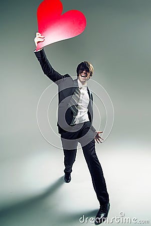 Joyful young boyfriend with a big heart Stock Photo