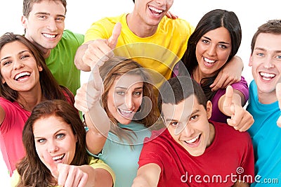 Joyful young friends thumb up Stock Photo