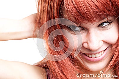 Joyful young woman with cute shy expression Stock Photo