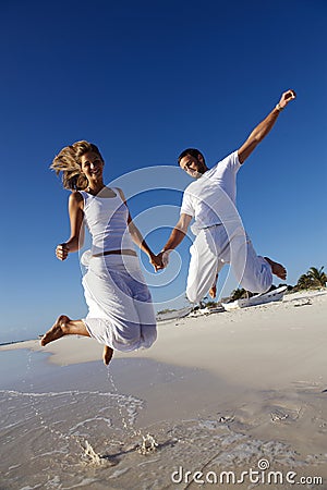Joyous couple on beach Stock Photo