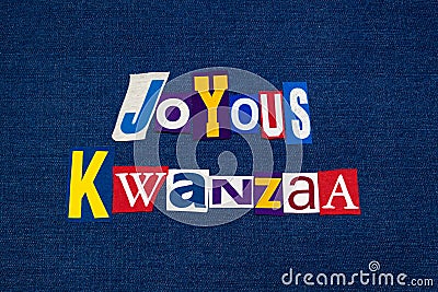 JOYOUS KWANZAA word text collage typography, multi colored fabric on blue denim, African American holiday Stock Photo