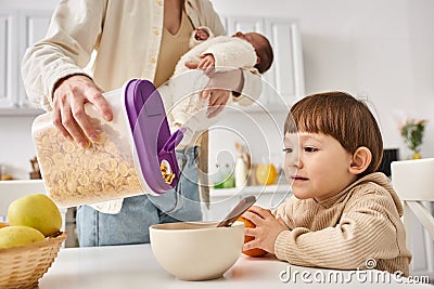 joyous woman pouring corn flakes to Stock Photo