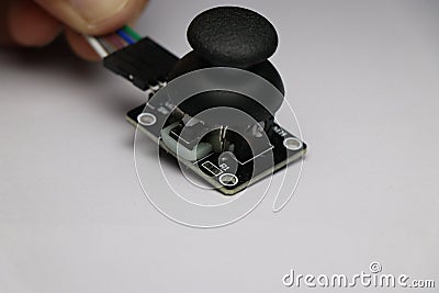 Joystick module used to make various arduino projects. Analog joystick module on white background Stock Photo