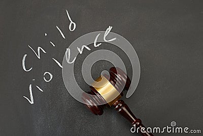 Judge gavel on blackboard background writing the word Stock Photo