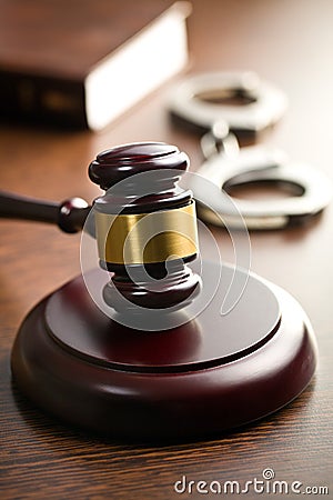 Judge gavel with handcuffs Stock Photo