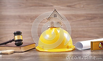 Judge gavel, house model, safety helmet, book Stock Photo