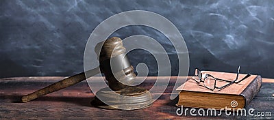 Judge gavel, old books and reading glasses on a wooden table, black board background. 3d illustration Cartoon Illustration