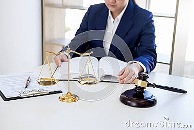 Judge gavel with scales of justice, professional female lawyers Stock Photo