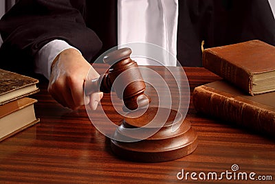 Judge hand with gavel Stock Photo